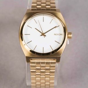 Gold Nixon time teller